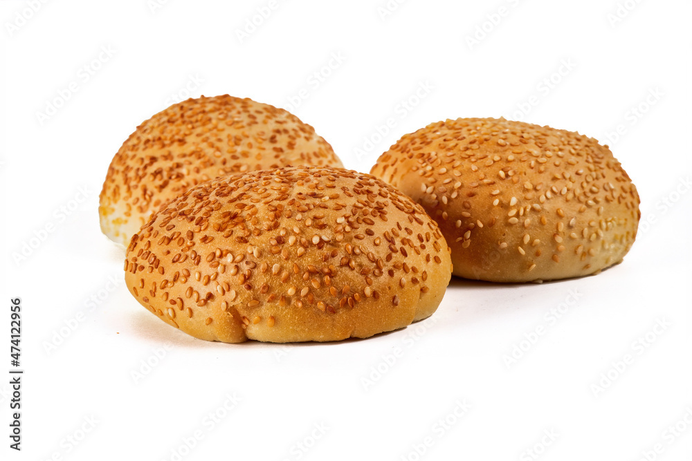 hamburger buns sprinkled with sesame seeds, isolated on a white background hamburger buns sprinkled with sesame seeds, isolated on a white background