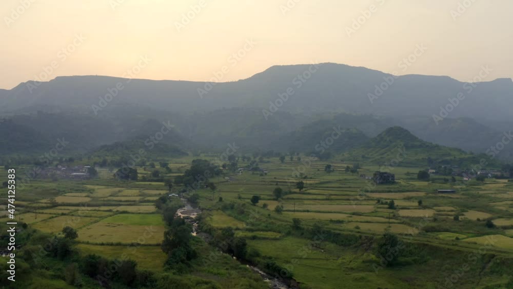 Green Agricultural Fields Of Karjat Town In Maharashta India - aerial shot Green Agricultural Fields Of Karjat Town In Maharashta India - aerial shot