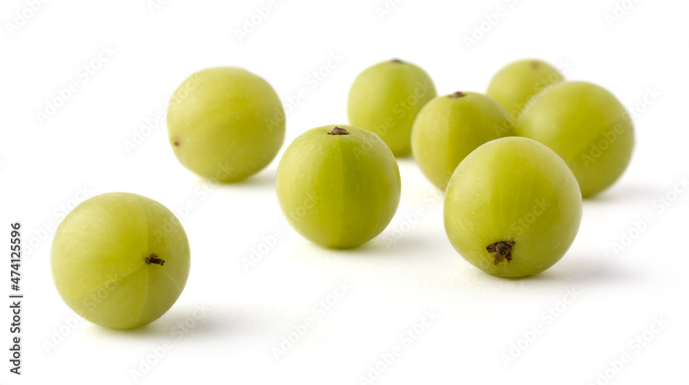 fresh amla or indian gooseberry isolated on white background, high vitamin c contain fruit closeup view, taken in shallow depth of field fresh amla or indian gooseberry isolated on white background, high vitamin c contain fruit closeup view, taken in shallow depth of field