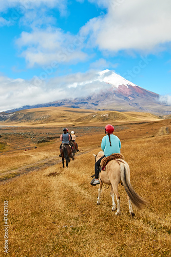 people on horseback in the landscape of the Andes  Cotopaxi