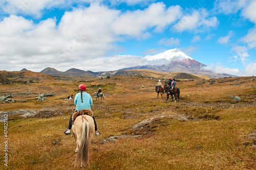 people on horseback in the landscape of the Andes, Cotopaxi photo