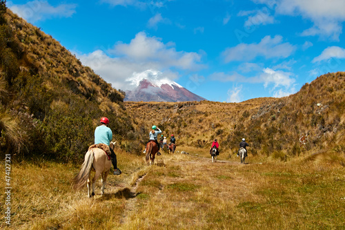 people on horseback in the landscape of the Andes, Cotopaxi photo