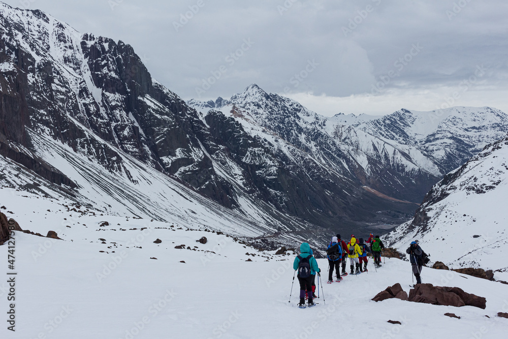 Trekking in winter season. Snowed mountains in La Egorda Valley, Cajón del Maipo, central Andes mountain range, Chile