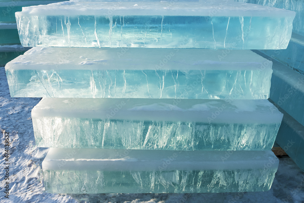 Blocks of transparent ice were prepared for the production of ice sculptures. Texture and pattern of natural material.