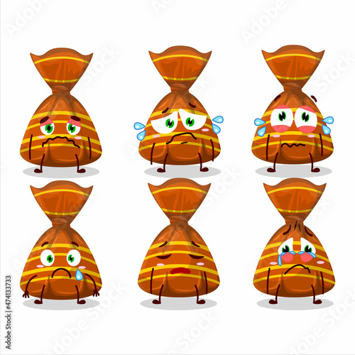 Orange candy wrappers cartoon character with sad expression