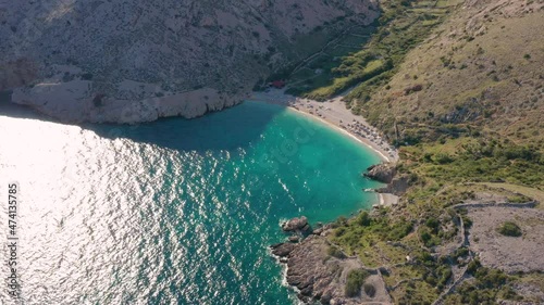 Small Beach Surrounded With Rocky Clifffs At The Shore Of Adriatic Coast In Krk, Croatia. aerial photo