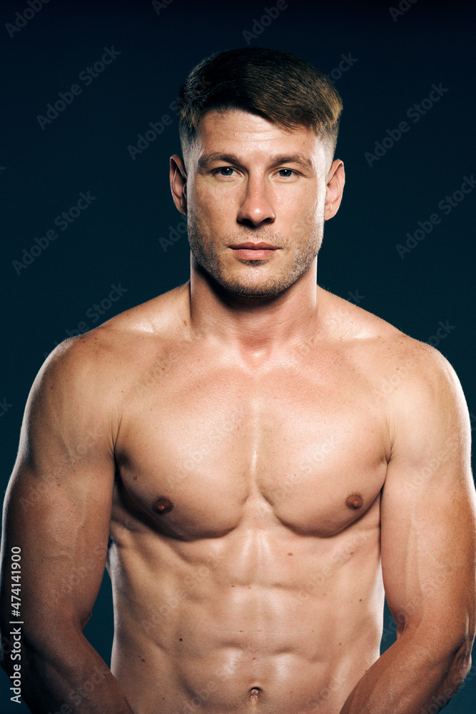 athletic male topless workout muscle bodybuilder dark background