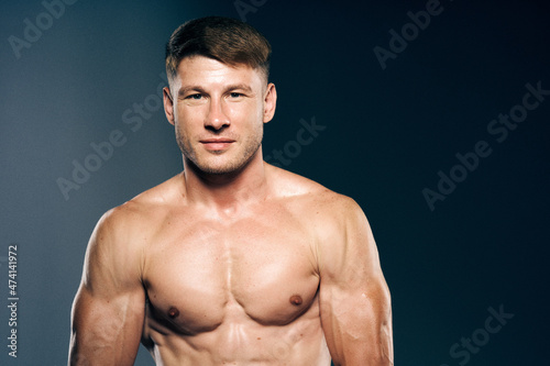 athletic male topless workout muscle bodybuilder dark background