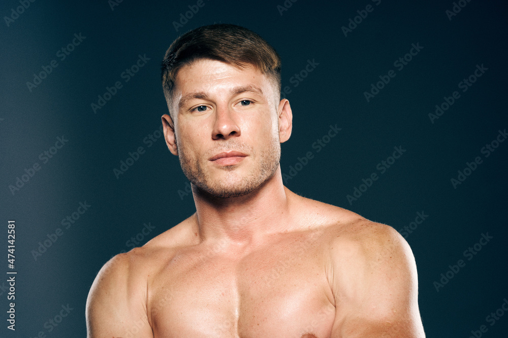 Fototapeta premium athletic male topless workout muscle bodybuilder dark background