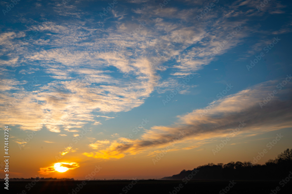 Autumn sunset outside the city in the village