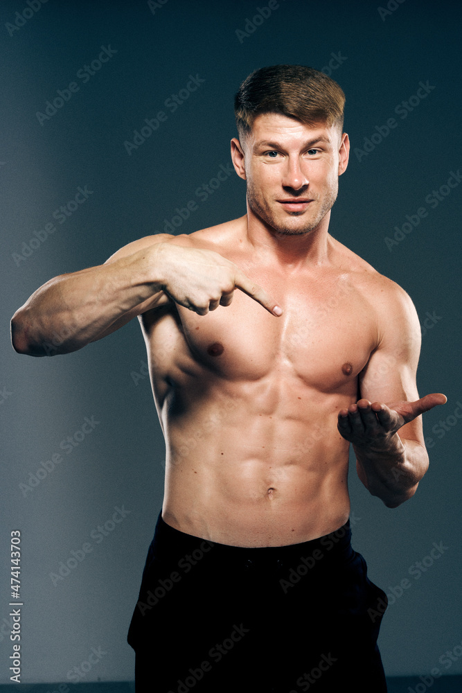 man with muscular torso workout fitness dark background man with muscular torso workout fitness dark background