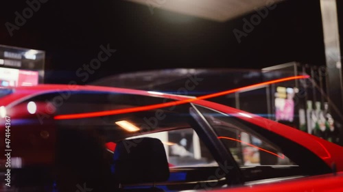 Woman With Afro Getting Out Of Red Ferrari 348 TB At Night photo