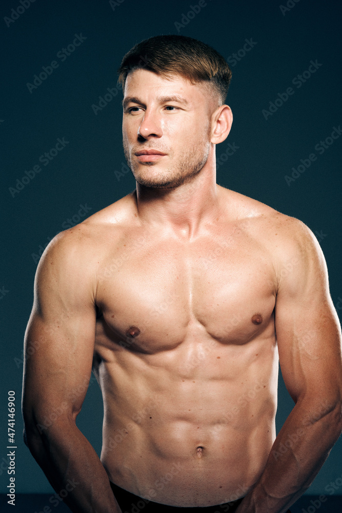 athletic male topless workout muscle bodybuilder dark background athletic male topless workout muscle bodybuilder dark background