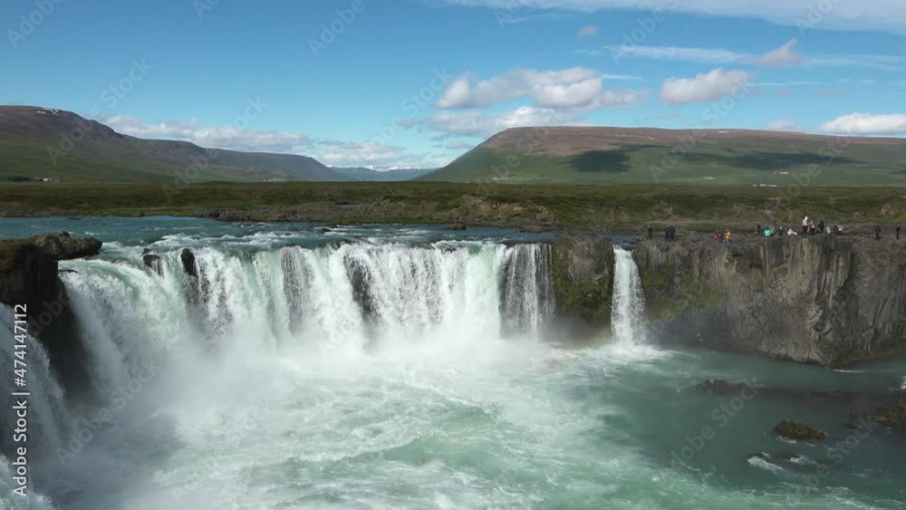 Iceland landscape scenic view of waterfall against cloudy sky. It is one of the famous tourist attractions. It is a spectacular Icelandic waterfall on the island.