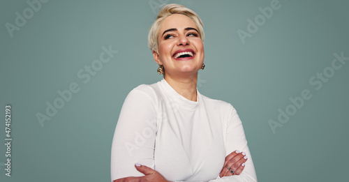 Slika na platnu Beautiful blonde woman laughing in a studio