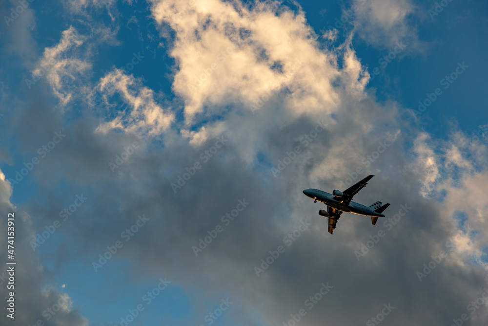 Airplane in the sky and cloud at sunrise