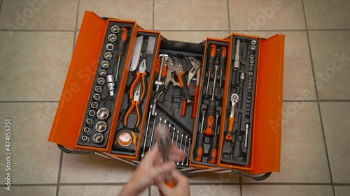 The plumber took a wrench from the toolbox.