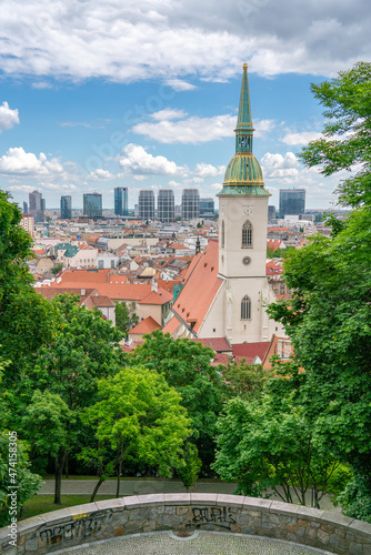 Bratislava cathedral with modern skyline and historic centre - park view