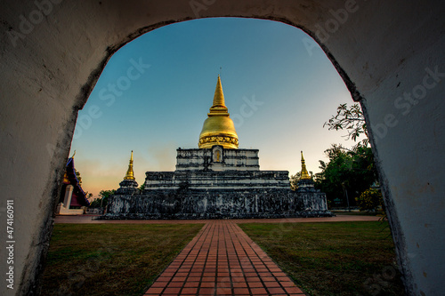 Background of important religious attractions in Thailand that are open for public viewing and making merit (Wat Phra Borommathat Thung Yang) Uttaradit) has an old chedi and a beautiful church.