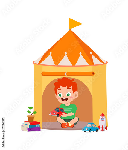 cute little boy play inside small tent