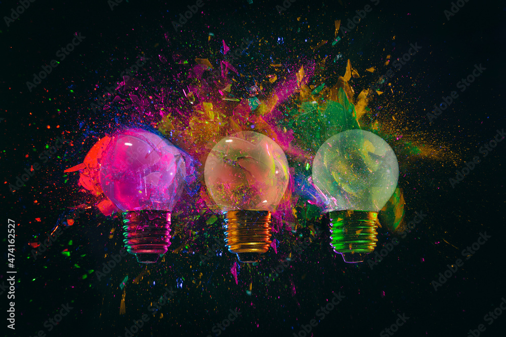 explosion of 3 colored light bulbs explosion of 3 colored light bulbs
