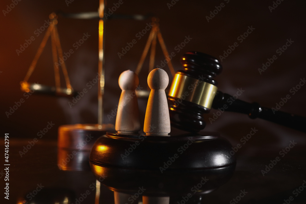 Wooden couple and gavel close-up Wooden couple and gavel close-up