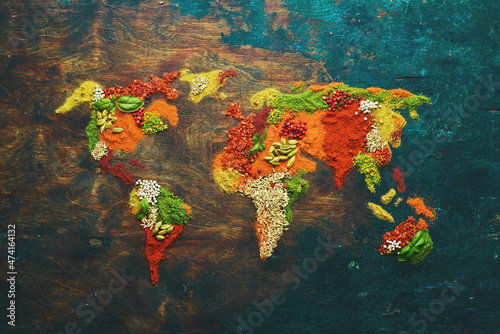 World map - Set of spices and condiments on a black background. Top view. photo