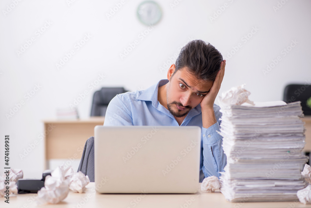 Young male employee rejecting new ideas in the office Young male employee rejecting new ideas in the office