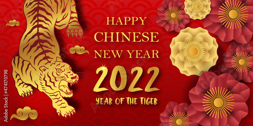 Happy chinese new year 2022, Year of the tiger with gold paper cut art style on red background (Chinese Translation : Tiger)