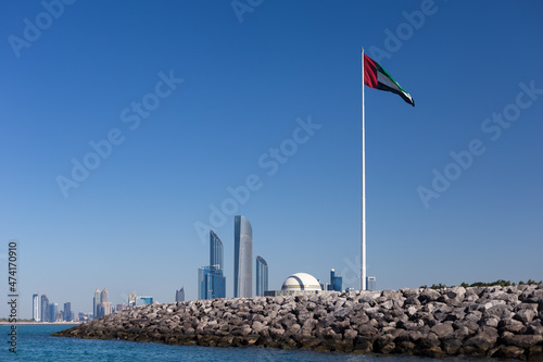 Abu Dhabi Skyline with UAE flag in United Arab Emirates