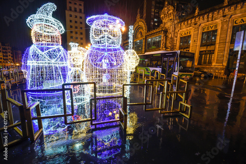 Olentzero illuminated next to the railway station in Bilbao at night