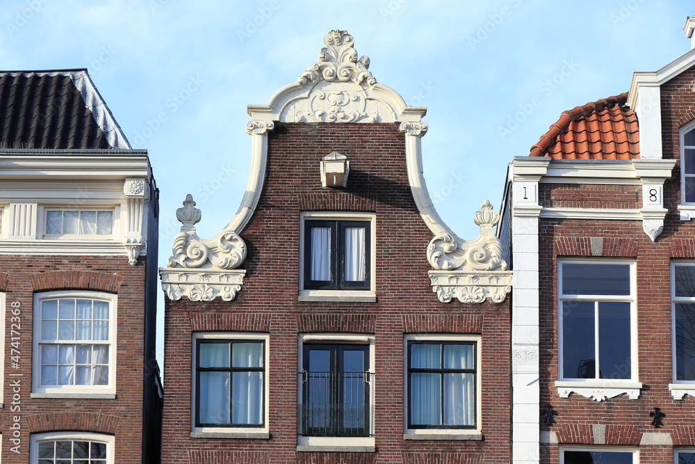 Historic Canal House Decorated Bell Gable Close Up in Amsterdam, Holland