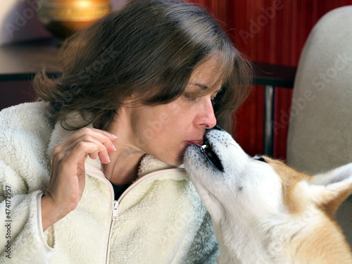Portrait of a woman and her dog. Meeting after parting. Pet love