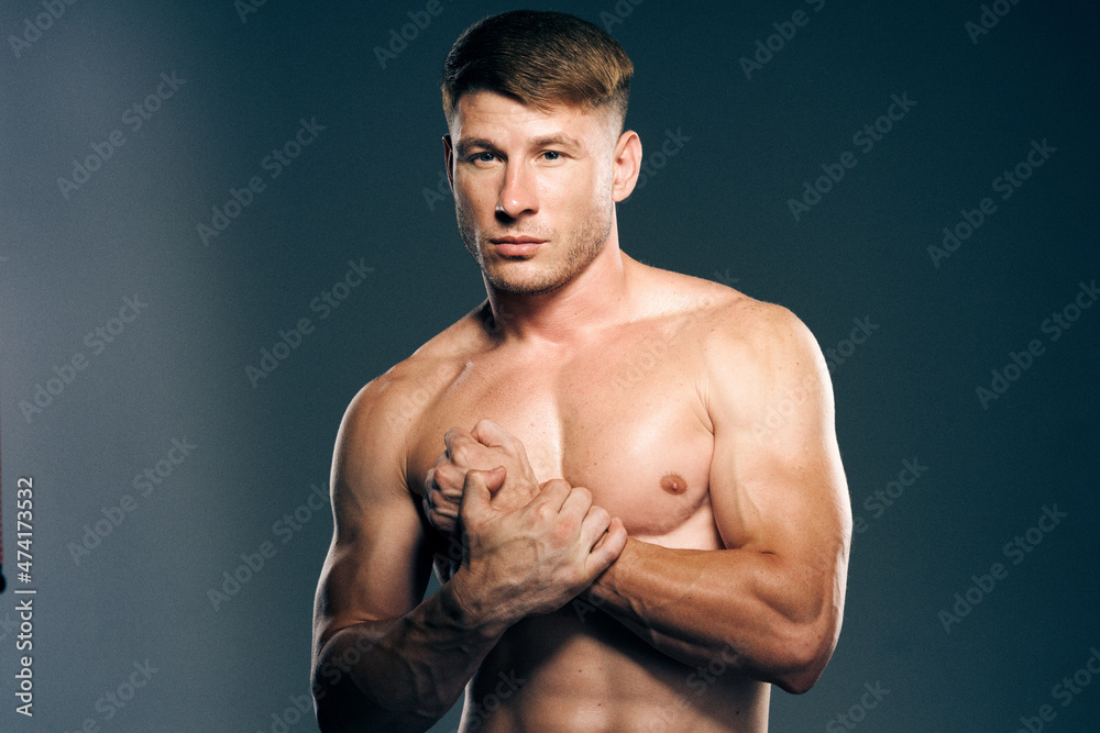 man with muscular torso workout fitness dark background man with muscular torso workout fitness dark background
