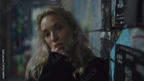 Wallpaper Mural Relaxed model looking camera at night city lights in downtown.  Torontodigital.ca