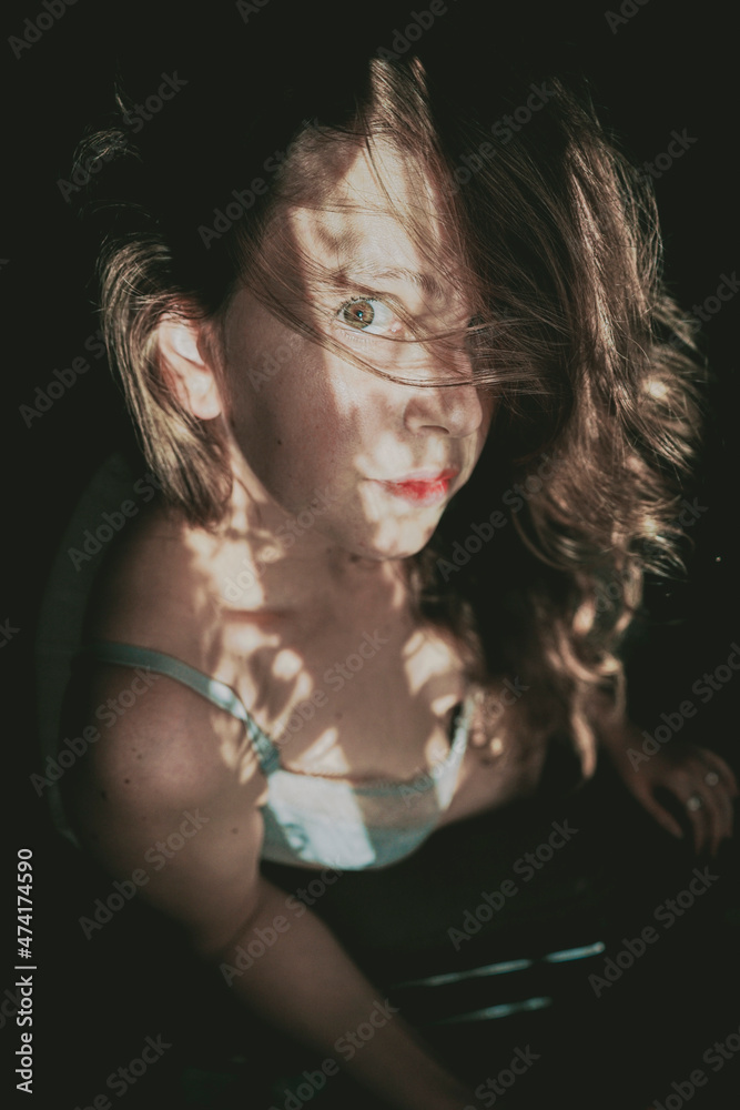 Artistic portrait of a young woman with retro shadow play style