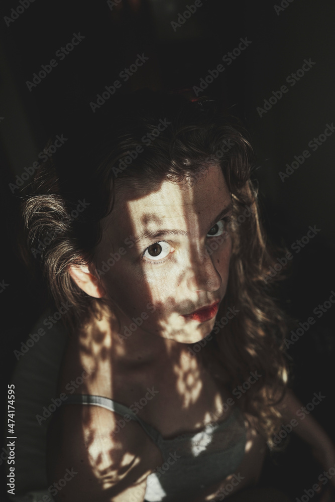 Artistic portrait of a young woman with retro shadow play style