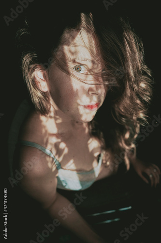 Obraz na płótnie Artistic portrait of a young woman with retro shadow play style w salonie