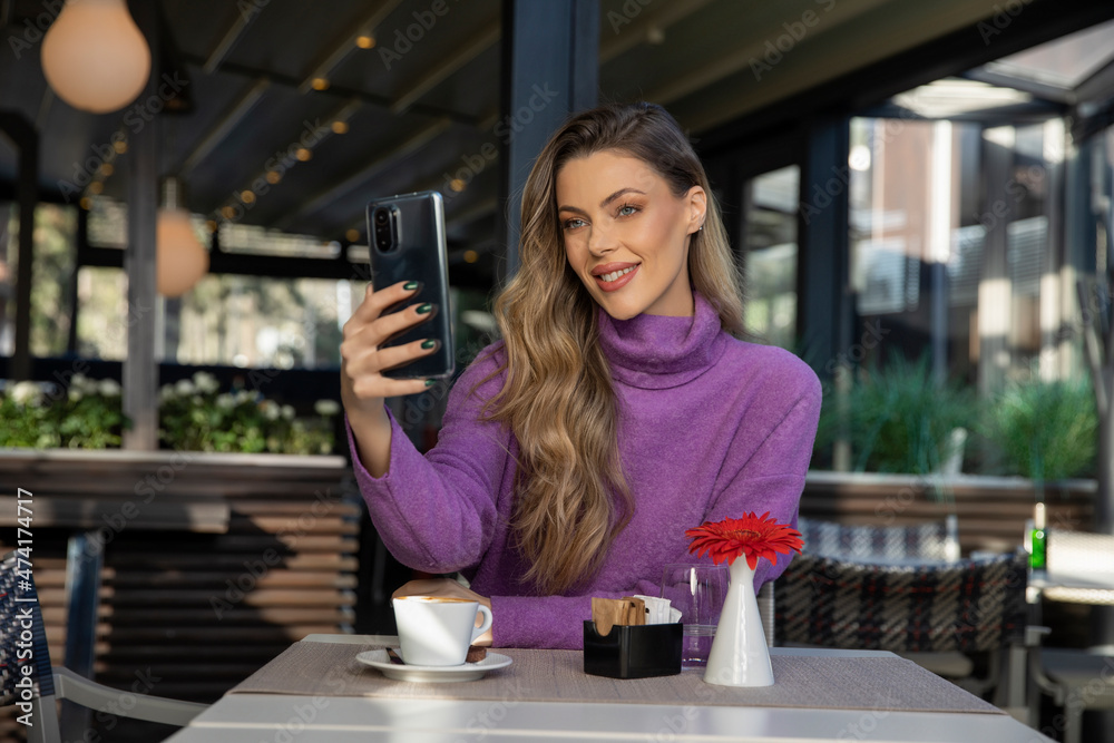 Beautiful woman taking selfie at the restaurant Beautiful woman taking selfie at the restaurant