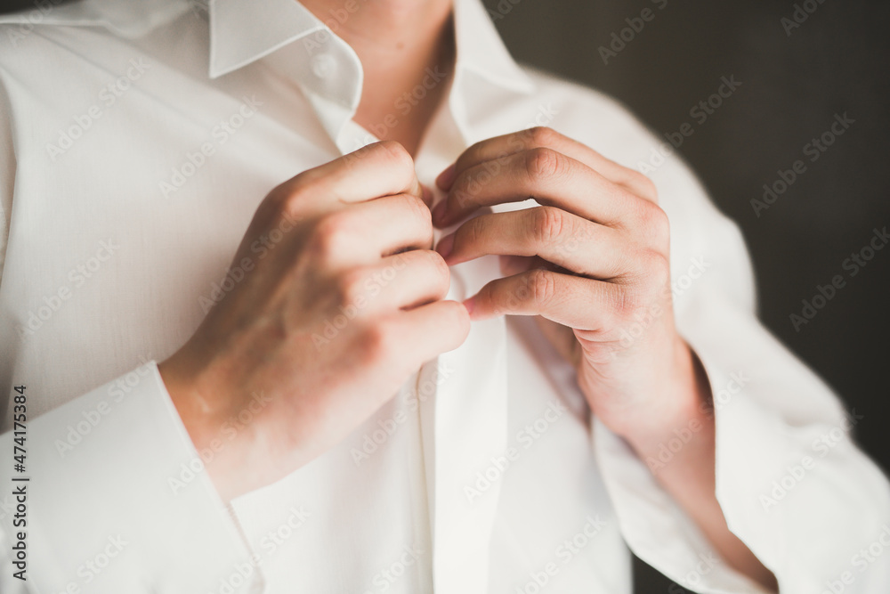Fototapeta premium Young handsome man relaxing at his apartment in a hotel after business meeting