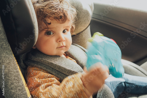 Wallpaper Mural Toddler inside a car sit in her baby safety seat Torontodigital.ca