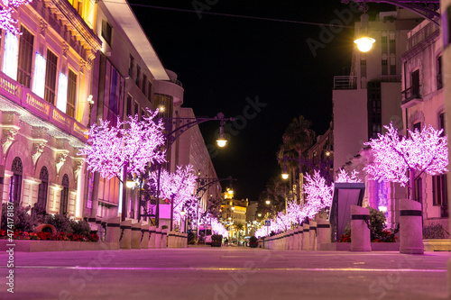 Artificial purple Christmas tree decoration, city night