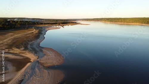 Wallpaper Mural Drone footage over an empty beach river. Cinematic sunset. Torontodigital.ca