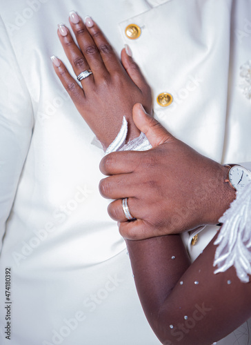 African bride and groom holding hands