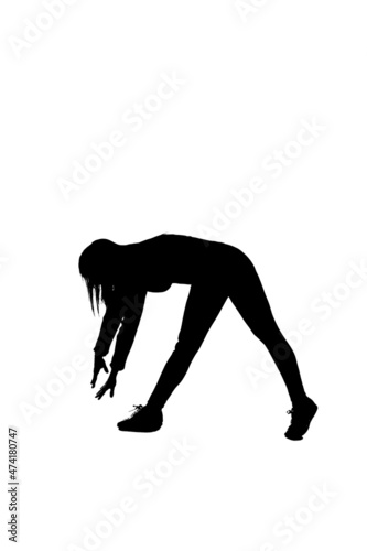 silhouette of girl doing warm-up gymnastic exercises