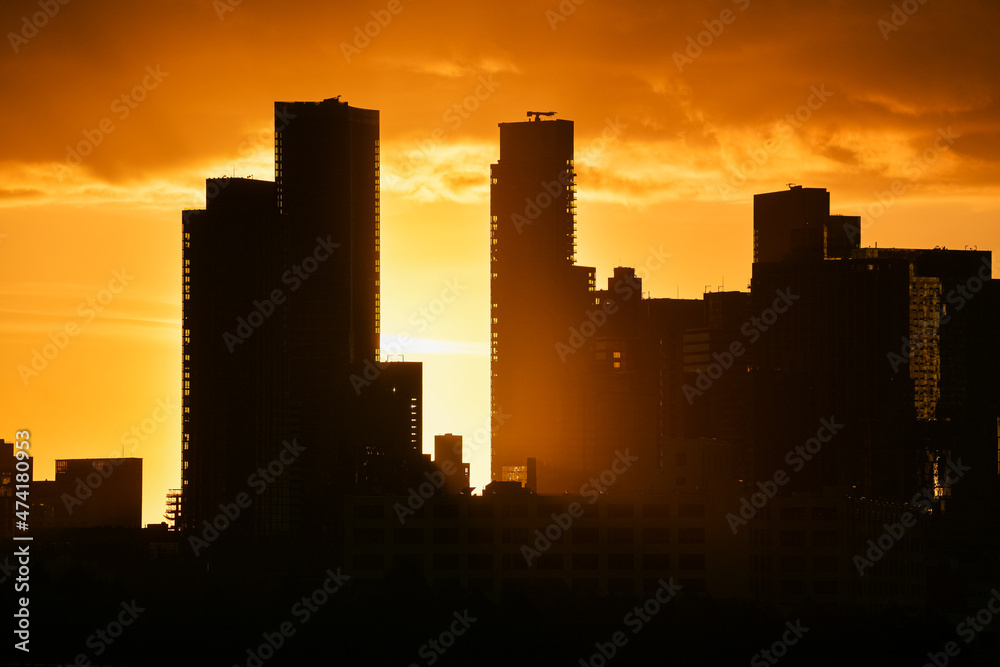 Sunrise in New York with dramatic sky and view to the tall skyscraper office buildings. Amazing color vibe. View to Astoria neighbourhood. Travel to America.