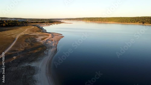 Drone footage over an empty beach river.