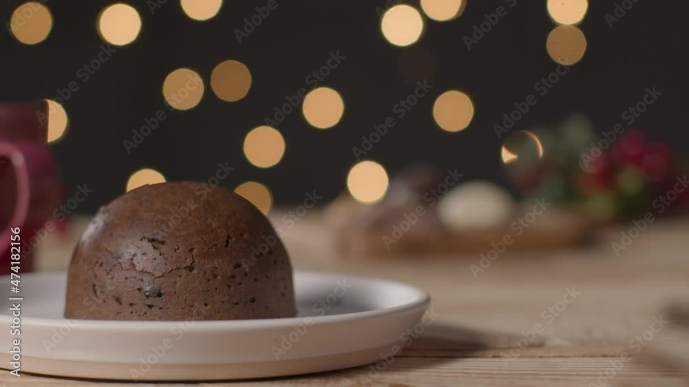 Sliding Shot of a Christmas Pudding On Table Sliding Shot of a Christmas Pudding On Table