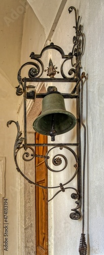 old bell at the wall photo