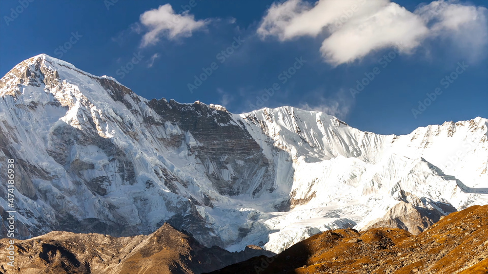 Mountain everest snow white cold freeze top of the world blue skies cloud shadow beautiful amazing view brown rock drone aerial chomolungma nepal tibet 